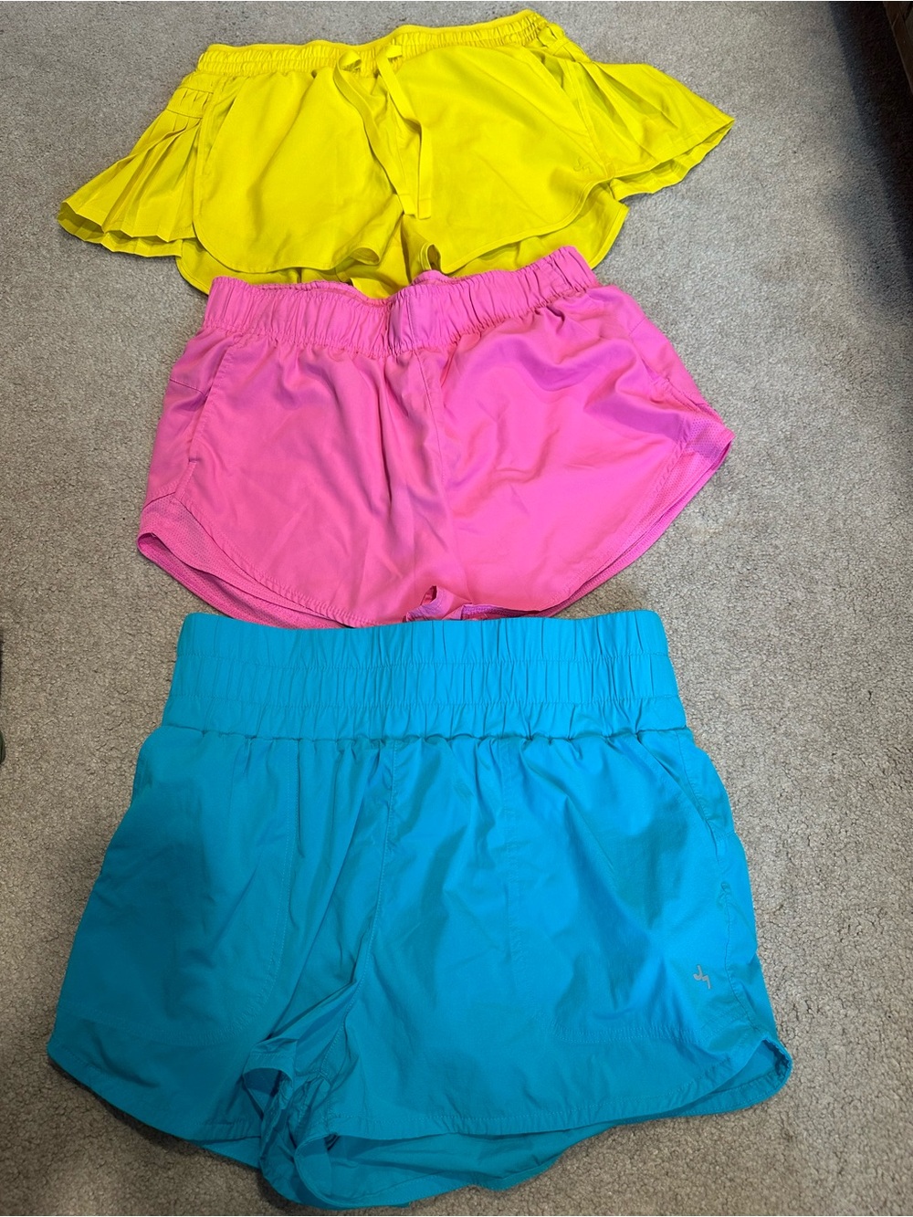 Women’s athletic clothes - 5 shorts, 2 skirts w/shorts, 1 shirt, 4 sports bras